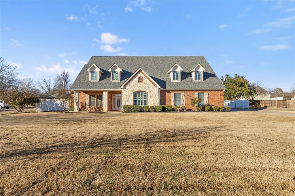 Set on over an acre in Mansfield ISD, this stunning custom-built residence blends timeless craftsmanship with high-end design and exceptional functionality. From the moment you step inside, rich real wood floors, elegant ceramic tile, Andersen windows, and classic plantation shutters create a warm, refined atmosphere filled with natural light.

Designed for both everyday comfort and elevated entertaining, the kitchen showcases granite countertops, real wood cabinetry, a stainless steel built in refrigerator, trash compactor, and a generous island with pendant lighting and breakfast bar, the heart of the home for gathering and connection.

The thoughtfully designed floor plan includes a private office featuring custom built-in shelving and a cedar closet, while three fireplaces are thoughtfully placed throughout the home, including the main living area, the primary bedroom, and an upstairs living space, adding warmth and character at every level. Upstairs, a spacious game room or optional bedroom, accessed through a private door at the top of the stairs, offers a full bath, walk-in closet  providing exceptional flexibility for guests, extended family, or a secluded retreat.

Step outside to enjoy true Texas living with a large covered patio, ideal for outdoor dining, entertaining, or relaxing while overlooking the pool and expansive backyard. The outdoor space is further enhanced by an impressive 30’ x 40’ x 14’ workshop or storage building with two roll-up doors, offering endless possibilities for hobbies, business use, or recreational storage.

The pool table conveys and most furnishings are negotiable, offering a unique opportunity for a seamless transition as the seller downsizes.

With its custom construction, luxury finishes, expansive outdoor living areas, generous acreage, and sought-after Mansfield ISD location, this exceptional property delivers space, comfort, and lifestyle rarely found together.