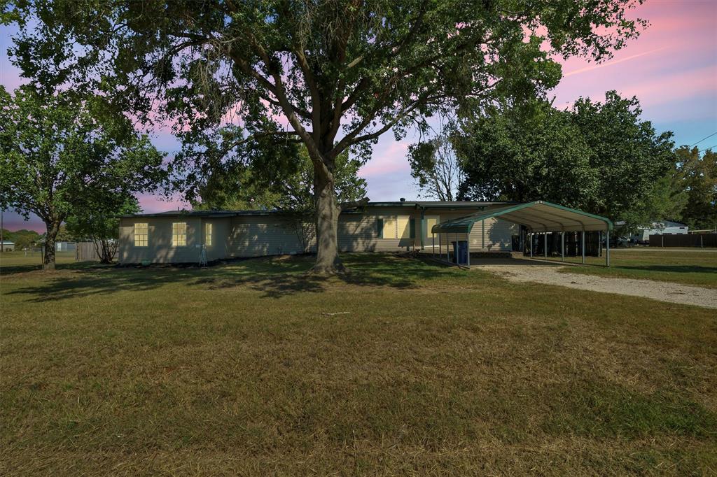 Motivated Seller!  He just asked me to drop the price!  This property is a true diamond in the rough, located within city limits. It features a spacious single-wide manufactured house with impressive additions, including a large attached mother-in-law suite with a kitchen, extra washer and dryer, bedroom, and living area. The house offers large rooms, clean interiors with fresh paint throughout, partial new flooring, and well-maintained hardwood floors. The large bathrooms add to the comfort. Situated on a generous corner lot, there's ample space to add a workshop or other outdoor amenities. Plus, with two driveways, parking is a breeze. A wonderful opportunity for customization and expansion!
Refrigrators and washer and dryers will stay with the property!