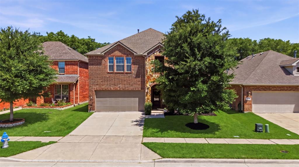 Perfectly positioned in PROSPER ISD with peaceful lot that back to the greenbelt, this beautifully designed 4-bedroom, 3-bath home stands apart from the rest with custom features and unforgettable personality throughout.
The front flex space immediately steals the show with stunning built-in bookshelves complete with a rolling library ladder — creating the perfect home office, reading retreat, or creative studio. Designer touches continue around every corner, from the custom dining banquette that makes everyday meals feel special to the thoughtfully curated finishes that bring warmth and character to each room. Even the laundry room delivers a dose of joy with elevated style and charm.
The functional floorplan offers both comfort and flexibility with the primary suite and a secondary bedroom downstairs, ideal for guests or multigenerational living. Upstairs, you’ll find two additional bedrooms, a spacious game room with more custom built-ins, and a dedicated media room ready for movie nights and game days.
Outside, the backyard was intentionally designed for gathering and conversation. Enjoy an extended patio, low-maintenance turf grass, and serene location in the neighborhood that creates a private and inviting outdoor retreat.
This is more than a home — it’s a thoughtfully crafted lifestyle filled with charm, functionality, and standout design in one of McKinney’s most desirable settings.