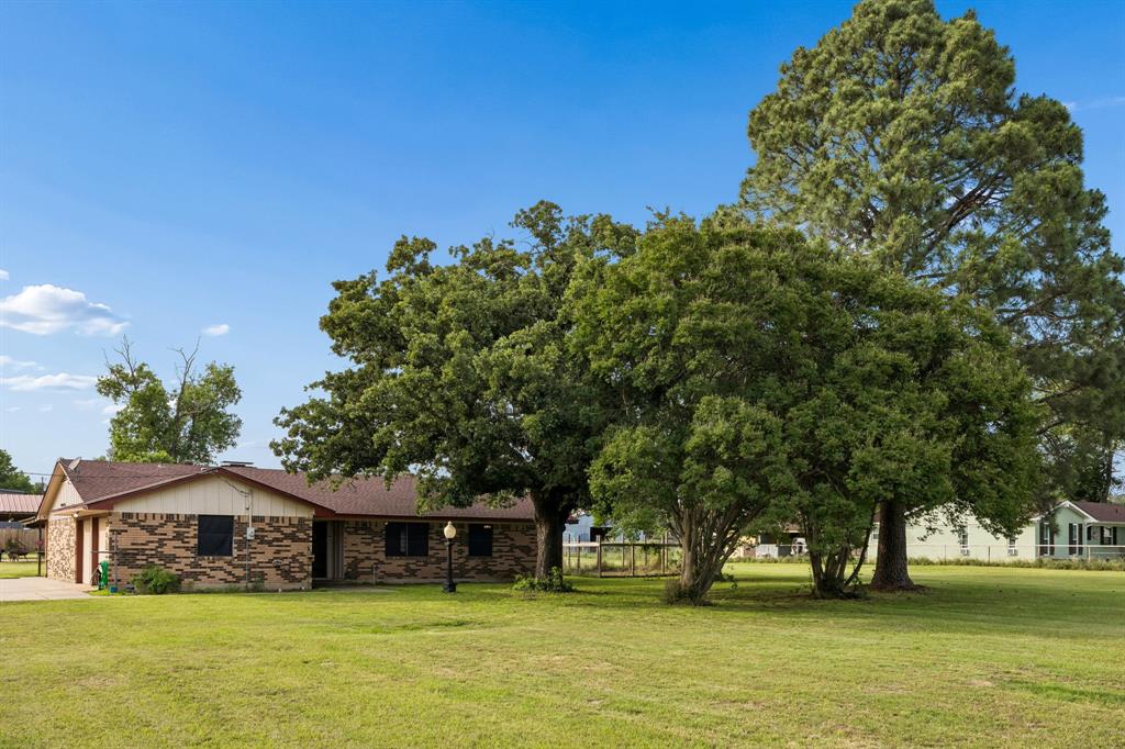 Discover this exceptional ranch-style home, perfectly situated on nearly 2 acres of serene Texas countryside. Mature trees frame the property, offering natural shade, privacy, and timeless charm. This level, usable land is an equestrian or livestock enthusiast’s paradise—ideal for horses, goats, or even a small hobby farm—with room to roam, graze, and grow.
Inside, the single-story layout flows effortlessly. The heart of the home is the expansive living room, anchored by a dramatic brick fireplace that stretches floor-to-ceiling and vaulted ceilings that create an open, airy feel. Three generously sized bedrooms provide comfort and flexibility, while two full bathrooms feature practical layouts ready for daily use or easy updates.
Just off the main living space, the two-car attached garage is finished out nicely, making it a seamless extension that could easily become additional living area, a home office, or a hobby room with minimal effort.
The crown jewel of the property is the detached 1,500-square-foot shop, measuring a spacious 50 feet long by 30 feet wide. Built for versatility, it includes a 20-by-30-foot covered carport plus a separate boat or trailer carport, offering protected parking and workspace for vehicles, equipment, or projects. Inside, high ceilings, insulation and steel framing, offer a perfect canvas to finish out as an in-law quarters or studio apartment. Best of all, a full bathroom is already here—simply connect to the existing septic system and you’re ready to host visitors or expand your living space instantly if finished out as a living space.  Located in Crandall ISD! 
This rare combination of comfortable ranch living, livestock-ready acreage, and massive outbuilding potential creates endless possibilities. Whether you envision weekend trail rides, a peaceful family compound, or a hobbyist’s workshop haven, this home on almost two acres is move-in ready yet brimming with future potential. Welcome to your forever Texas retreat.