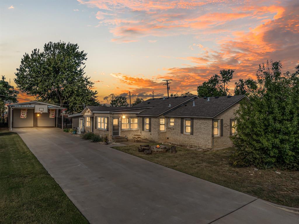 Come see this beautifully remodeled 4-bedroom home on a large corner lot with a Workshop! Beyond the amazing location and versatile floorplan, this house has been upgraded inside and out in the places that count. From the roof to the floors (including subfloors) to the new windows (many tilt open), HVAC, plumbing, and electrical updates to the 130' of flatwork in the driveway, the remodel has been extensive. The isolated Primary Suite is spacious and features a large walk-in closet as well as a beautifully tiled shower and oversized jetted tub. The 896sf workshop has 2 Bay Doors that are 10'6x10' and has been rewired for 900Amp service with compatibility to 220V as needed. The carport is 23.5ft wide and hosts a Regulation-Size & Height Basketball hoop mounted on the front. Privacy fencing includes a gate for vehicle access as needed, and there are multiple patios around the home to enjoy. Surrounded in freshly paved roads and with new fiber optic cable installation, this is a unique property with so much to offer!