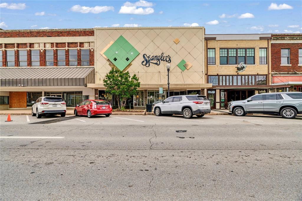 Don’t miss this rare opportunity to own a one-of-a-kind property in the heart of beautiful downtown Paris, Texas. Offering over 16,200 square feet of flexible space, this building is ideal for retail, loft conversions, or a dynamic mixed-use setup—perfect for entrepreneurs and investors alike. The interior boasts stunning picture windows, a spacious mezzanine, and two upper floors that feature residential living quarters, blending commercial potential with livable charm.

The property includes a private office, generous storage areas, and convenient dual access—via the main entrance at 15 N. Main Street and an additional rear alley entry. On the 20 North Plaza side, the storefront captures attention with its classic awning, double-door entry, and glass-encased display windows that naturally draw in foot traffic. This side of the building is particularly sought after, thanks to its historically accurate 1960s-era architecture, making it stand out among neighboring structures on the Plaza.

Recent upgrades ensure modern comfort and code compliance, including a brand-new roof on the 15 N. Main side, a new HVAC system, updated electrical and lighting, and a state-of-the-art sprinkler system with full monitoring and alarm capabilities—fully up to 2025 safety standards.

Whether you're seeking a flagship retail location, a unique live-work space, or an income-generating investment property, this exceptional offering delivers unparalleled potential in a prime downtown location.