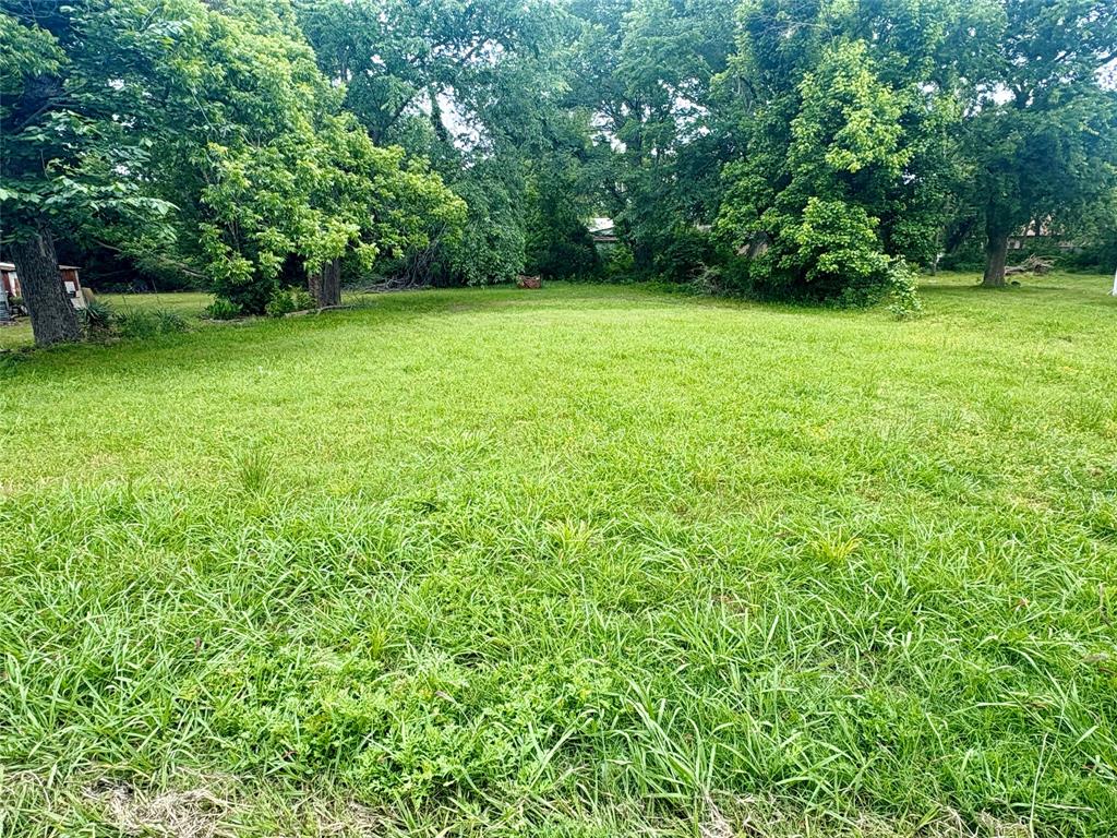*Owner Financing Available - Contact Listing Agent for details or questions*
Build your future in the growing community of Bonham with this spacious residential lot offering just over a quarter acre of opportunity. The level terrain provides an ideal foundation for new construction. Mature trees along the back of the property create a natural privacy buffer, perfect for enjoying outdoor gatherings, relaxing evenings, or future backyard amenities.

Whether you’re planning a custom home, investment property, or exploring the potential for duplex development (subject to city approval), this property offers flexibility and long-term potential in an expanding area.

Conveniently located near local shopping, grocery stores, restaurants, schools, and everyday essentials, the property also provides easy access to popular area destinations including Bonham State Park, historic downtown Bonham, and Lake Bonham for outdoor recreation and fishing. Commuters and investors alike will appreciate the property’s accessibility to the greater Dallas–Fort Worth metroplex, offering small-town living with convenient connections to the Metroplex.

With growth continuing throughout North Texas, this property presents an excellent opportunity to build, invest, or hold for the future.