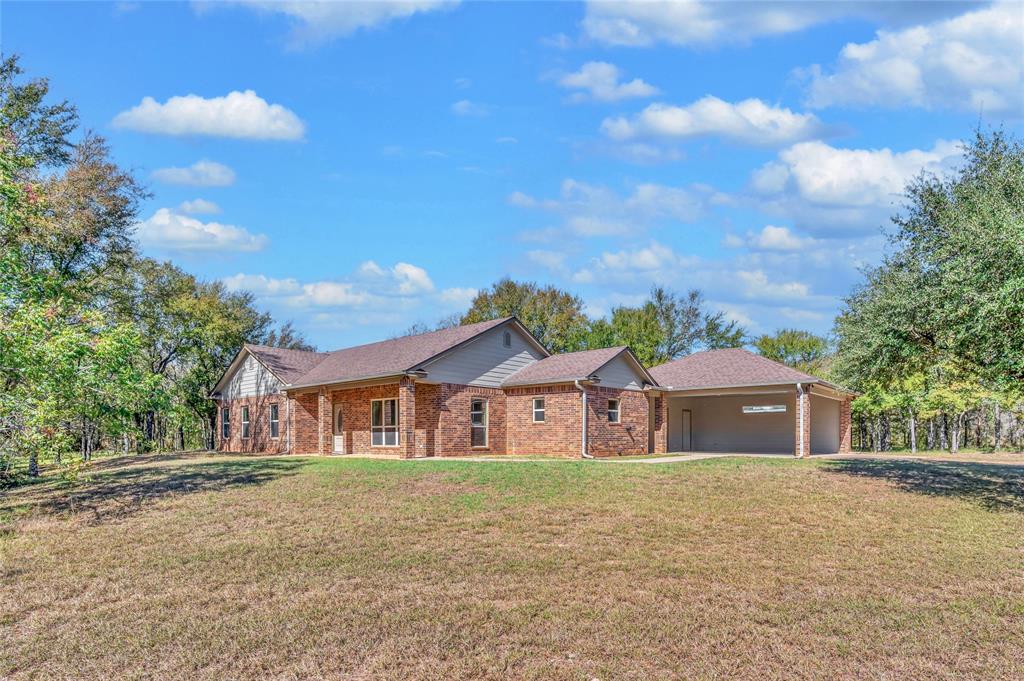 Five beautiful acres with established trees in Robinson ISD. Gently rolling land with a tank that stays full year-round. The brick home sits back from the road, quiet and shaded, with a practical layout and foam insulation to keep the bills friendly. Outside, the oversized carport includes a 30-amp plug for an RV or weekend projects. Quiet shade, abundant wildlife, and a stocked tank ready for weekends. The privacy you want, in the location you need.