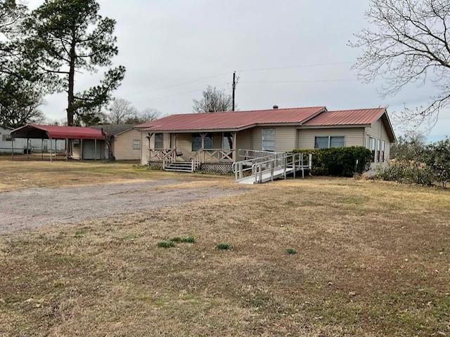 Charming 3 bedroom, 2 bath home situated on approximately .41 acres in a quiet country setting with great neighbors. This property offers exceptional accessibility features, including a metal handicap ramp and thoughtfully designed interior spaces. Enjoy relaxing on the large front porch complete with a porch swing, as well as a spacious back porch ideal for outdoor living.

The kitchen was expanded and updated several years ago and features stainless steel appliances including a range, vent hood, and dishwasher, along with abundant whitewashed cabinetry, multiple drawers, two corner turn table cabinets, and a large pantry providing excellent storage. The dining area opens to an ample sized utility laundry room through a sliding barn door.

Two bedrooms are generously sized, with a third bedroom that would also make an ideal home office. One bedroom includes an open bath area designed for easy wheelchair access, featuring a large 5x5 walk in shower and custom-built cedar cabinets and vanity. Another bedroom offers a large walk in closet with a cedar encased combination gun safe.

Additional highlights include a metal double carport with attached workshop garage, making this property ideal for the avid handyman or hobbyist. With a few improvements and cosmetic updates, this home presents a strong investment opportunity while also offering valuable handicap accessible features. Located in a peaceful country setting, this property combines functionality, potential, and long term value.