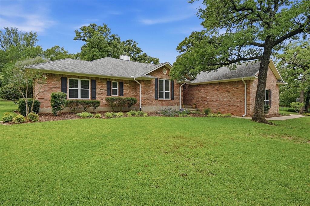 Tucked away on a private and peaceful street in the gated community of Lake Kiowa, this incredible property sits on a rare double lot surrounded by towering mature trees and fresh landscaping that create a truly serene setting. Enjoy year-round relaxation from the screened porch while taking in peaceful backyard views, bird watching, and the beauty of the spacious outdoor space.

Inside, the open concept design is filled with natural light and highlighted by high ceilings that create an airy and welcoming feel. The kitchen, living room, dining area, and primary bedroom have all been freshly painted, giving the home a crisp and refreshed look.

Beyond the home itself, the possibilities continue with an impressive detached structure featuring a 3-car garage, two climate-controlled offices, and a convenient half bathroom. Whether you need workspace, hobby space, storage, a studio, or room for creative projects, this versatile setup offers endless potential. Combined with the attached 2-car garage and ample parking throughout the property, there is room for everything and everyone.

A rare opportunity to enjoy peaceful living, functional space, and exceptional versatility all in one remarkable Lake Kiowa property.
