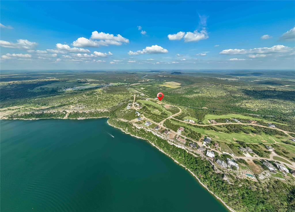 One of a kind home site with stunning views of the Brazos River Valley, easy access to Possum Kingdom Lake and all the amenities of the exclusive Cliffs Resort. The Cliffs Resort is a gated residential community perched 200 feet above beautiful Possum Kingdom Lake. The natural canyons, water views, and rolling hills provide an unparalleled environment. Owners enjoy a serene environment with 24 hour security and onsite amenities, including the 18-hole Championship golf course, Hotel, The Chaparral Grille and Spurs Bar, three swimming pools, The Cliffs Marina, RV camping, parks, a conference center, a spa and fitness center, and more.