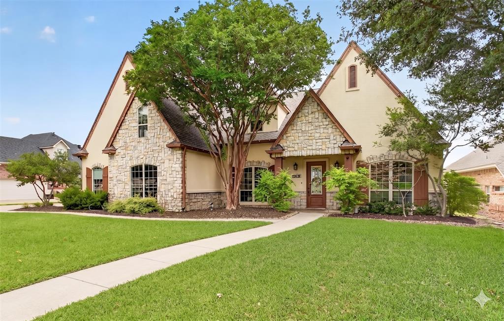 Experience luxury and comfort in this extraordinary executive-style home in NW Fort Worth near Eagle Mountain Lake. Offering 4 or 5 bedrooms, 4.5 baths, 3-car garage and over 4,400 square feet of beautifully designed living space, this stunning residence is filled with upgrades & timeless elegance. Rich wood flooring, soaring ceilings, neutral décor, & walls of windows create a light-filled atmosphere with beautiful views of the backyard oasis. The flexible floor plan includes a formal dining room & formal living area that can easily serve as a private home office. The gourmet kitchen is a chef’s dream featuring a spacious butcher block island, granite countertops, top-of-the-line stainless appliances, gas cooking, double ovens, & abundant cabinetry. The luxurious primary suite offers a newly remodeled bathroom and oversized walk-in closet with dressing area. A highly desirable MIL or NextGen suite with ensuite bath is privately situated on the opposite side of the home, perfect for guests or multigenerational living. Upstairs features two additional bedrooms with ensuite or Jack-and-Jill bath access plus a massive flex room, ideal for a theater, game room, gym, homeschool space, or crafts. Step outside to your own private botanical paradise complete with a sparkling saltwater pool, lush landscaping, pergola, covered patio, outdoor gas grill, & peaceful natural surroundings filled with abundant local wildlife. Designed for both entertaining and relaxation, this backyard retreat is truly unforgettable. Additional items included with property are washer & dryer, appliances, security system, patio furniture & all TVs for a move-in-ready experience. Conveniently located just 30 minutes from downtown Fort Worth and minutes from Lockheed Martin, TCC, Naval Air Station Joint Reserve Base, Meacham International Airport, and approximately 45 minutes from DFW Airport, this exceptional property combines luxury living, privacy and convenience in one remarkable home. MUST SEE!
