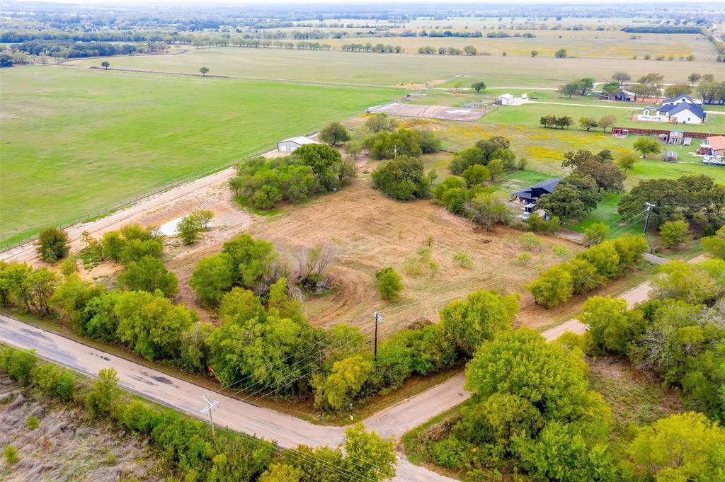 Almost 2.5 acres on a dreamy, picturesque property for your future barndominium, or custom home, on a one of a kind corner lot with a pond. This property is a must see. Scattered trees throughout, allowing you to choose the perfect location for your home. Great location with ease whether visiting the City of Cleburne, Rio Vista or commuting to I35. Great opportunity to move to the country with the convenience of the city.