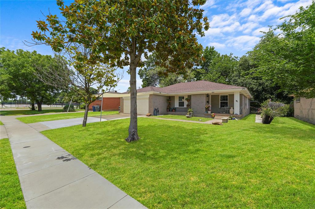 Beautifully renovated and move-in ready, this charming 4-bedroom, 2-bath home offers 1,820 sq. ft. of stylish living space designed for making memories. The open-concept floor plan creates a warm and inviting atmosphere, perfect for family gatherings and entertaining friends. Enjoy a spacious living room with a cozy fireplace, an updated kitchen featuring modern finishes and ample counter space, and a private primary suite with a beautifully remodeled bath. Three additional bedrooms provide plenty of room for family, guests, or a home office. The large backyard and 2-car garage add convenience and space to enjoy both indoors and out. Renovated just one year ago, this home is ready for its next chapter. Located within walking distance to Samuel High School and with easy access to I-635, I-20, I-30, and Highway 175, you'll love the convenience of this prime location.