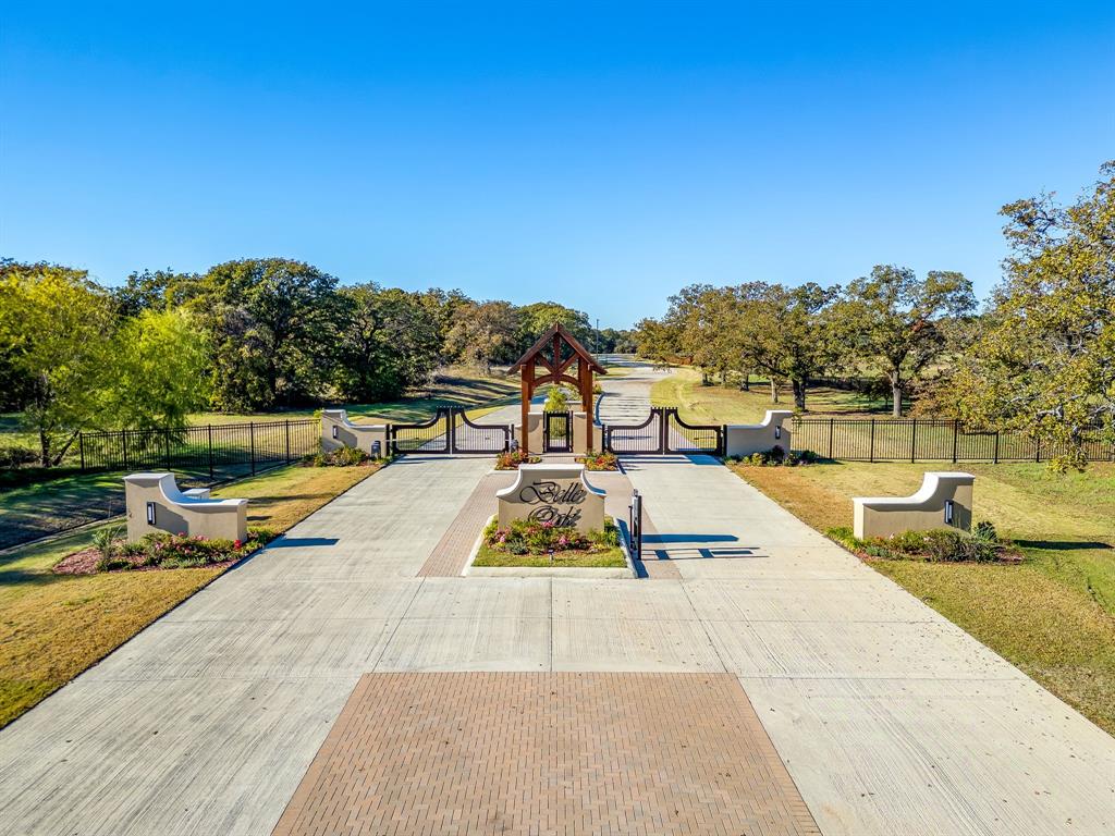 Exclusive Gated Community Lots For Sale in Burleson – Joshua ISD.  Discover luxury living in this pristine, private gated subdivision in Burleson, Texas. These premium lots are surrounded by an abundance of mature oak trees, offering a serene, natural setting with the perfect blend of exclusivity and convenience. Concrete streets, beautifully maintained grounds, and thoughtful community design set the tone for an elevated lifestyle.  Located in highly sought-after Joshua ISD and just 28 minutes from Downtown Fort Worth via the Chisholm Trail Parkway, this community provides both peace and accessibility. With generous lot sizes and a “bring your own builder” opportunity, you have the freedom to design a custom home that fits your vision.  Perfect for those seeking privacy, luxury, and a timeless setting—these lots are a rare find in one of the area’s most desirable gated neighborhoods.