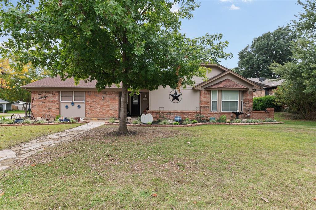 Beautifully updated home in Juniper Hill on a large corner lot! This amazing and well cared for 3 bedroom home has custom touches throughout including custom Pecan cabinetry in the large island kitchen, updated bathrooms, and engineered flooring. This home features 3 large bedrooms, a massive backyard with entertaining area including a covered patio, deck, bar, as well as 2 shops or storage buildings, boat or RV parking, and a ton of yard space. The location is also perfect... easy access to Green Oaks and minutes from I-20, Lake Arlington, and Martin HS. This home is equipped with a solar system and energy costs are a fraction of the cost of utility provided services.