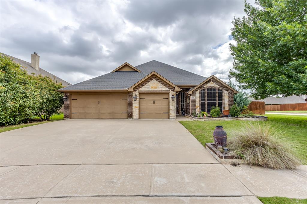 Fantastic 3 Bedroom, 2 Bath, 3 Car Garage Home on Corner Lot in Shannon Creek! Property Features: Huge 20x18 Covered Patio with Outdoor Kitchen with Grill, TV, Refrigerator. Open Concept Island Kitchen with Granite Counters, Breakfast Bar, Built in Oven and Microwave. Breakfast Room. Spacious Living Room with Wood Floors and Wood Burning Fireplace. Study with French Doors or Optional 4th Bedroom. Formal Dining Area or Sitting Room. Primary Suite with Tray Ceilings, Double Vanities, Walk In Shower, Jetted Tub, Walk In Closets. 2 Additional Guest Rooms and Guest Bath. Large Utility Room with Cabinets and Granite. 3 Car Garage. Sprinkler System. Gutters. Newer Roof. Corner Lot. Fantastic Backyard with Outdoor Kitchen and Living Area. Additional Concrete Pad for Firepit. A Must See!