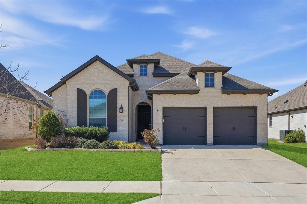 This one-story home built by Highland Homes is located in the vibrant Tavolo Park community and is a short walking distance to the greenbelt and gorgeous amenity center and pool. This highly sought after open concept floor plan with soaring ceilings, arched wide doorways, upgraded flooring, fixtures, tile, hardware & granite. Built-in dining buffet with wine rack, beautiful stone fireplace, a large eat-in chefs' kitchen with an abundance of custom cabinets, stunning granite counter tops a very large granite island perfect for entertaining. The home features a private office and also a media room which could be converted to a fourth bedroom. Spilt bedroom floor plan, private owner's suite includes dual vanities, walk-in shower, garden tub and a large walk-in closet with custom closet system.