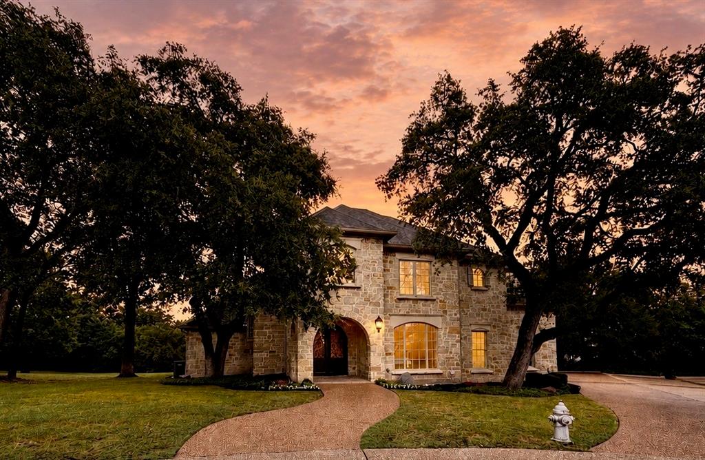 Nestled on a private cul-de-sac within the exclusive gated community of Scenic Village, this exceptional residence offers a rare blend of luxury, privacy, and convenience just minutes from downtown Fort Worth. Surrounded by mature trees and lush landscaping, the home provides a peaceful retreat while remaining close to premier dining, shopping, entertainment, and cultural attractions. Spanning approximately 3,909 square feet, this thoughtfully designed home features 4 bedrooms, 3.5 baths, and two spacious living areas ideal for both everyday living and entertaining. The gourmet kitchen is appointed with premium appliances, including a built-in refrigerator, Wolf double ovens, a professional-grade chef’s range, wine refrigeration, and an ice maker, creating a space that is as functional as it is beautiful. Expansive windows fill the home with natural light and showcase picturesque views of the surrounding trees. The versatile floor plan offers generous living spaces, timeless finishes, and an inviting atmosphere throughout. Additional features include an electric vehicle charging station and HOA-maintained front yard landscaping for a convenient, low-maintenance lifestyle. Ideally located just five minutes from Downtown Fort Worth and approximately ten minutes from the Fort Worth Stockyards, this home offers easy access to the best of the city while maintaining the tranquility of a secluded neighborhood setting. The adjacent lot at 1100 Brae Court is also available and may be purchased separately or together, presenting a rare opportunity to create an expanded estate property in one of Fort Worth’s most desirable gated communities. Luxury, location, and lifestyle converge in this remarkable Scenic Village home