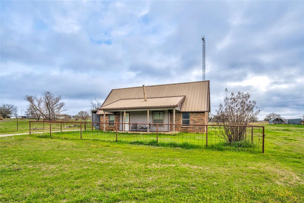 Nestled on 1.997 acres in the peaceful countryside, this charming 4-bedroom, 2-bath farmhouse offers the perfect blend of rural living and everyday comfort. Bring your animals and enjoy the freedom of country life with outbuildings already in place for chickens, goats, sheep, or even cows—your very own Green Acres.

The home includes the owner suite and guest bedroom on the first floor separated by an open concept living space.  Additional 2 bedrooms are located on the second floor with a bath to share. 

The spacious property provides plenty of room for gardening, outdoor entertaining, and family gatherings, while the large yard gives both people and animals space to roam and enjoy the open air. Start your mornings or unwind in the evenings on the inviting covered front porch, taking in the quiet country surroundings.

Whether you're dreaming of planting a garden, raising animals, or simply enjoying wide-open space, this farmhouse offers the perfect opportunity to add your finishing touches to create your own rural retreat.

Country charm, room to grow, with space to live the lifestyle you’ve been dreaming of.