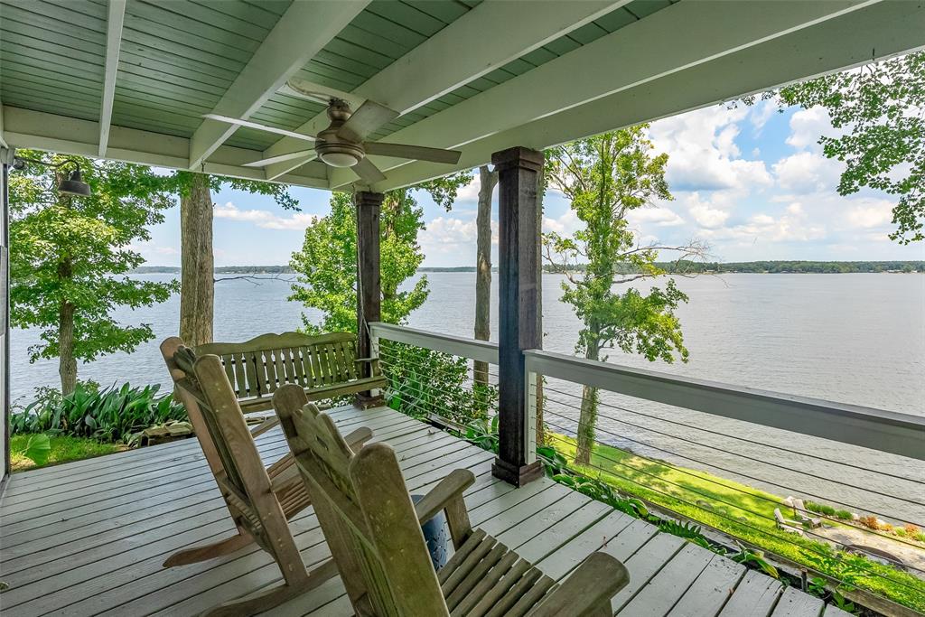 Nestled on the serene shores of Lanan Bay at Toledo Bend, this stunning home offers a perfect blend of natural beauty and modern luxury. The most sought after area of the lake - open water (no stumps) to swim, boat, ski, tube and knee board right in front of your lake house! Enjoy peaceful walks down to the private beach, where the tranquil waters and golden sunsets create an unforgettable backdrop. Spacious porches, both upstairs and downstairs, invite you to relax and take in the scenic views, while cozy evenings by the outdoor fire pit provide the perfect setting for stargazing or unwinding with loved ones. The property boasts a charming boat house for easy lake access, and a unique teepee that adds a whimsical touch to this lakeside retreat. Inside, homeowners will revel in the natural light pouring through high-end Pella windows, enhancing the home’s completely updated interior. Outside, an added RV area with full hookups ensures convenience for guests or extra storage. This Toledo Bend gem is a rare find, offering an exceptional lifestyle surrounded by the beauty of nature. Schedule your private tour of this lakeside oasis today!
