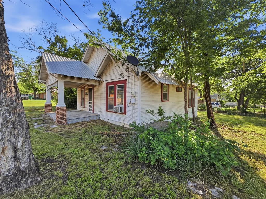 COMMERCIAL POTENTIAL WITH HIGHWAY 281 FRONTAGE! Situated on a high-visibility corner lot at 908 S Rice St, this property offers approximately 125 feet of frontage on State Hwy 281. Currently a 1,032 sq. ft. 3 bedroom, 1-bath frame home, the property is being sold as is and is a prime candidate for a full remodel or a commercial conversion.

Built in 1945 the home features a durable metal roof, hardwood floors un exiting flooring and a pier-and-beam foundation. The oversized corner lot provides ample space for parking or expansion. Whether you’re looking for a residential fixer-upper with a massive yard or a strategic business location in the heart of Hamilton, this property offers endless possibilities. Buyer to verify all zoning and utility requirements for commercial use.