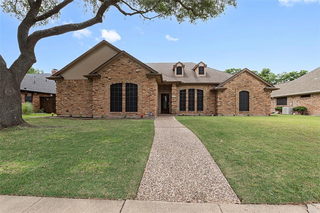 Nestled on a picturesque tree-lined street in the heart of Rowlett, this charming traditional brick home offers timeless curb appeal and a thoughtfully designed floor plan perfect for comfortable everyday living. Inside, you’ll find a spacious living room with vaulted ceilings, beautiful wood trim, built-in cabinetry, and an abundance of windows that fill the home with natural light.

The home features three bedrooms, a dedicated office, and a generously sized primary suite with a stunning ensuite bath complete with a new standalone soaking tub and separate walk-in shower. Fresh paint throughout creates a bright, airy feel, while updated wood-look flooring and carpet add warmth and style to the main living areas and bedrooms.

The kitchen is move-in ready with all brand-new appliances, and the oversized garage includes additional workspace for hobbies, storage, or projects. Outside, mature trees provide shade and character in both the front and backyard. A bonus shed with electricity offers endless flexibility for a workshop, studio, gym, or extra storage.