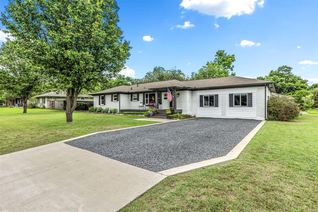 Charming fully renovated 3-bedroom, 2-bath home ideally located just minutes from Historic Downtown McKinney. Situated on an oversized lot with mature trees and incredible curb appeal, this thoughtfully updated home blends modern design with timeless character.
Step inside to an open-concept layout filled with natural light, hardwood flooring, designer finishes, and spacious living areas perfect for entertaining. The beautifully remodeled kitchen features crisp white cabinetry, subway tile backsplash, stainless steel appliances, gas range, oversized island with seating, and abundant prep and storage space, all opening seamlessly to the dining and living areas.
A separate oversized family room is a true standout with soaring vaulted ceilings, exposed wood beams, and expansive windows that create a warm yet airy atmosphere. The primary suite offers a relaxing retreat with updated finishes and ample space, while the secondary bedrooms are generously sized and thoughtfully designed.
Outside, enjoy a large backyard with a covered pergola patio ideal for outdoor dining and entertaining. The detached backyard outbuilding offers endless possibilities as a home office, gym, art studio, or extra storage. Additional highlights include an inviting front porch, modern fixtures throughout, updated bathrooms, and plenty of yard space for play or gardening.
Located near the shops, dining, entertainment, and charm of Downtown McKinney, this move-in ready home offers the perfect combination of style, comfort, and location. Lot is large enough to add a garage or carport.