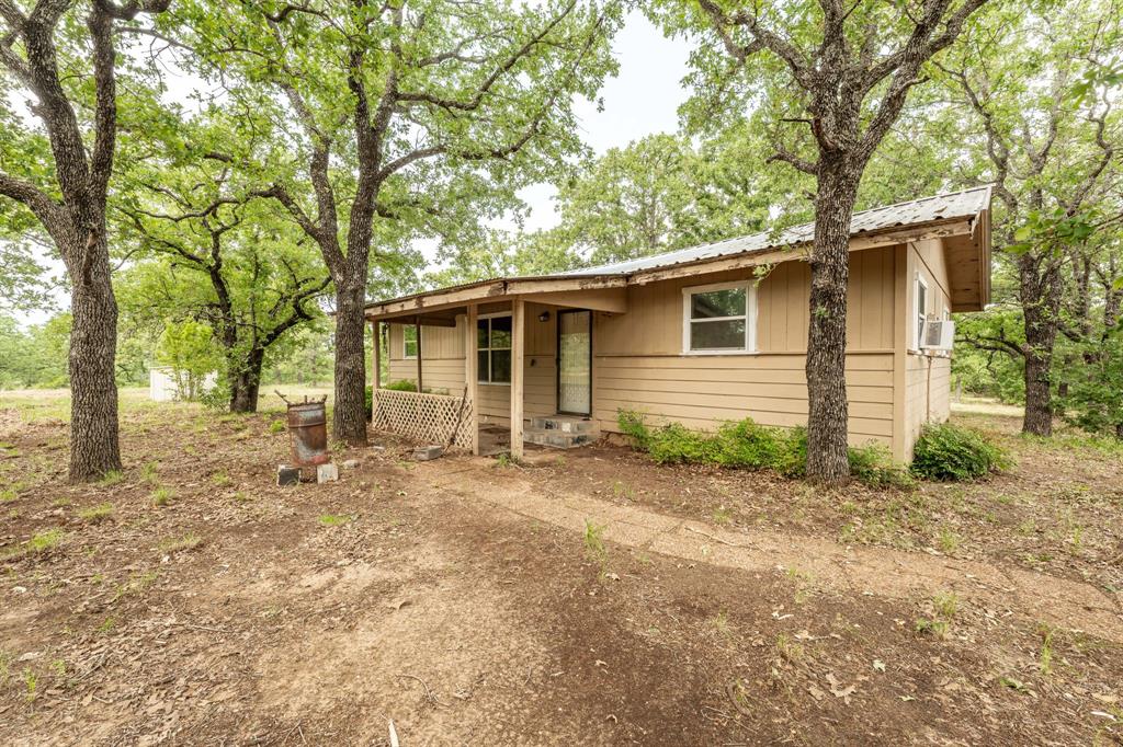 Fantastic weekend getaway!! Check this one out!! This property is located just one mile Lake Proctor! There is an older home on the property that has 2 bedrooms, and 2 baths! The property has a wildlife exemption as well as a Homestead exemption on it! The home is older and needs to be completely updated! This place is so so very private and has some of the most amazing Oak Trees you have ever seen! There are so many deer and other wildlife on this place! This is a fantastic budget friendly opportunity for an amazing little hunting property and the house will work perfectly for a hunting camp! There is a good water well on the property! There is also a very cool creek running along the west side of the property! This little place has so much to offer, so come take a look and make it your very own!!