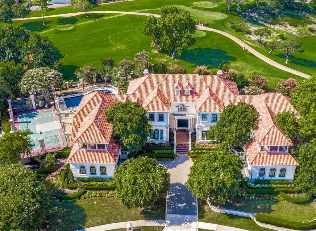 Breathtaking Las Colinas Golf Course estate on 0.82 acres! Almost 10,000 sf of luxury designed to inspire. One of the highest points in Dallas County overlooking the Four Seasons Golf Course and Las Colinas. Main floor has dining, study, bar, family room, living room, HUGE Master and 2 addtl beds with ensuite bath. Fabulous oak flooring, incredible millwork, crown molding, & wood cased arches throughout the home. Take the elevator to the 2nd floor to find guest suite with separate living, incredible gameroom & wetbar, exercise room, workroom & large 5th bedroom. Full size sport court for basketball and tennis with heated pool and spa secluded by mature landscaping. Two oversized two car garages with work areas.