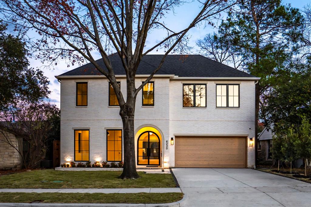 This 4-bedroom, 4.1-bath, 4,703-SF new construction home by Select Custom Homes feeds to Mockingbird Elementary. Custom iron french doors welcome you in to a series of elegant archways that add architectural interest. The dining area is highlighted by a vaulted ceiling, creating volume and visual appeal as an everyday or formal space. The living room is anchored by a stunning quartzite fluted fireplace,  framed by arched built-ins. At the heart of the home, the chef’s kitchen features white oak cabinetry, Mont Blanc quartzite with custom double bullnose edging, and a reeded, rounded island that feels highly current while remaining timeless. A sub zero refrigerator, Bertazonni range, and 2 dishwashers  with an expanded prep counter and a spacious walk-in pantry enhance everyday functionality while bolstering the quality of the home. Soaring 11-foot ceilings extend throughout the first floor, complemented by a full bar for entertaining. The first floor also includes a private guest suite with a full en-suite bath and direct backyard access, a dedicated office with coffered beams and built-in storage. Upstairs, additional en-suite bedrooms and a versatile combination gym and game room adapt easily to modern lifestyles. The primary suite serves as a true retreat, featuring coffered beams, arched dual vanities, and a generously sized walk-in closet with a large marble-topped island. Wide-plank white oak flooring, smooth museum walls, curated lighting, Andersen 100 windows, and thoughtfully selected stone finishes underscore the superior build quality. An expansive patio slider strengthen the indoor-outdoor connection, while the backyard is sized can be customized to suit your lifestyle. Built for efficiency and longevity, the home includes an engineered foundation, full foam insulation, 2 Trane HVAC systems, and two tankless water heaters. Ideally located near Lakewood’s shops, dining, and community lifestyle, 4230 Concho is a refined expression of transitional luxury.