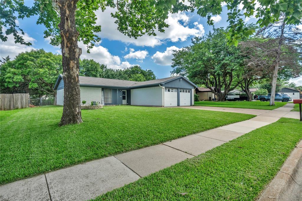 Charming, Affordable Home on a Lush Quarter-Acre Cul-de-Sac Lot! Welcome home to this well-maintained 3-bedroom, 2-bath property nestled on an almost quarter-acre lot in a desirable cul-de-sac location near Dunsworth Park. Offering a perfect blend of comfort, value, and convenience, this home is an excellent opportunity for first-time buyers or anyone looking for extra outdoor space.  Step inside to find durable vinyl plank flooring throughout all 3 bedrooms, tile flooring in the kitchen, and a cozy carpeted living room designed for everyday comfort. Two gorgeous glass French doors fill the home with natural light and provide beautiful views of the lush backyard.  Outside, you'll discover a large covered wood deck - perfect for relaxing, entertaining, or enjoying your morning coffee while overlooking the meticulously maintained yard. The former owner took exceptional pride in the landscaping, and it shows throughout the property. Two storage sheds provide ample room for tools, hobbies, and outdoor equipment, while the spacious garage offers additional storage and functionality. The kitchen comes complete with a refrigerator that conveys with the property, adding even more value. Secondary bedrooms feature generously sized walk-in closets, providing plenty of storage space for family members or guests.  Conveniently located with easy access to major roads, shopping, dining, and everyday amenities, this affordable home offers the best of both worlds - a peaceful neighborhood setting with quick access to everything you need.  Don't miss your chance to own this move-in-ready gem with space, charm, and exceptional value!