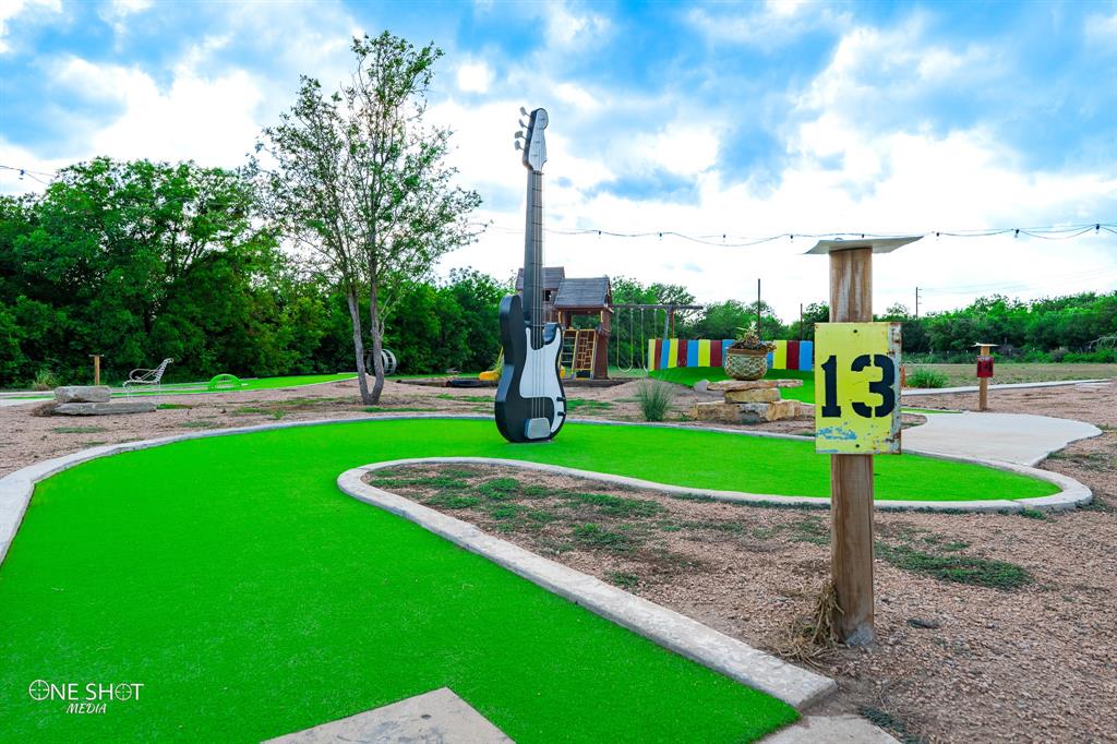 Don’t miss an opportunity to come join the growing community at Coleman,TX. Whether you are a miniature golf enthusiast or entrepreneurs or investor, take note of this incredible commercial opportunity. A custom, one of a kind, 18-hole miniature golf course with 4m Forever lawn putting surface, Hack Attack batting cages, and outdoor games. The kitchen, in its own distinct building, boast a stainless steel Artesian Duel Fuel Wood-Fired and Propane Gas Brick fired Pizza Oven, refrigerated prep table, also provides ample space for other food preparation. Sitting on 5 acres with abundant pecans and six beautiful peach trees, this property is just a start of its potential with plenty of room for future development. Aside from gated entrance to the parking and golf course, the other side of the property has a newly added gated entrance for the future development of this land. This could be utilized for an RV park, mini houses, or an extension of more family entertainment! Incredible opportunity awaits.