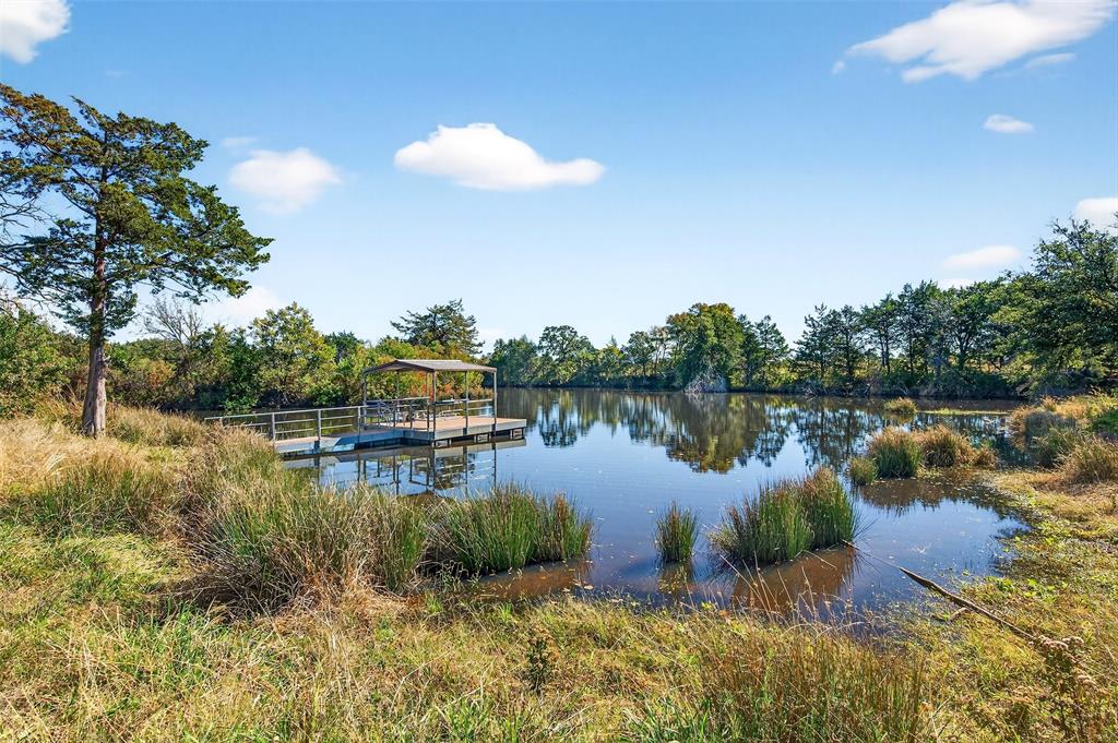 Rare opportunity to own a premier 33-acre AG-exempt estate in the highly sought-after Whitesboro area. This exceptional property offers the perfect blend of natural beauty, RECREATION, and INVESTMENT POTENTIAL. Enjoy a LARGE STOCKED POND complete with a recreational FLOATING BARGE, scenic creek, MATURE TREES, and rolling terrain that create a picturesque setting with MULTIPLE HOMESITE OPTIONS showcasing sweeping countryside views.

Designed for a luxury custom home, family ranch, recreational retreat, or future investment, the property features an active AGRICULTURE EXEMPTION for valuable tax savings, a WATER WELL ON-SITE, WATER-LINES NEAR PROPERTY and irrigation capabilities for up to 11 acres. A pond fountain is also available to enhance the property's beauty and functionality.

Conveniently located just minutes from Hwy 377, this peaceful country retreat offers easy access to WHITESBORO, SHERMAN, and LAKE TEXOMA while maintaining privacy and tranquility. Owner will consider subdividing. With stunning natural features, recreational amenities, existing infrastructure, and long-term flexibility, this is a rare opportunity to create your dream estate or legacy property in one of North Texas' most desirable growth areas.