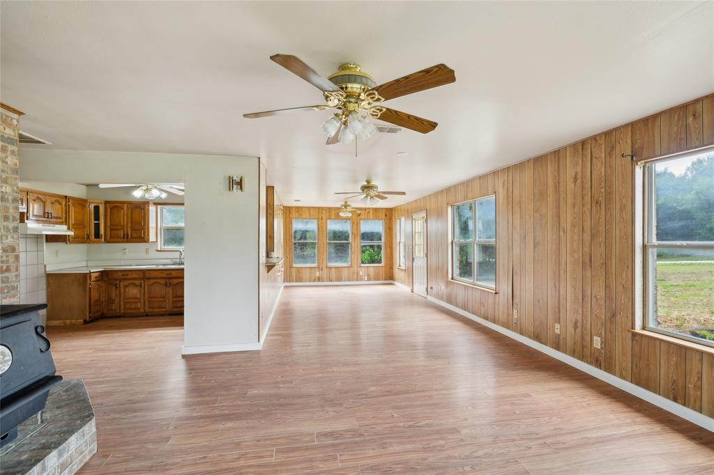 Discover space and potential in the rolling hills of Grayson County. This 7.76-acre property features a 2-bedroom, 2-bathroom main residence with a 2-car attached garage, offering a unique canvas for investors or renovators. Below the main living area, a 1,000-square-foot basement provides adaptable space that is ideal for a workshop, extensive storage, or creative projects. The property also includes a 600-square-foot standalone efficiency apartment that is perfectly suited for a private guest retreat or generating rental income. Outside, a serene 1.5-acre pond is located at the back of the property for fishing or enjoying the rural view. While the home requires several updates and repairs, the layout and location provide significant upside. Situated directly behind the Grayson County Speedway, which is not included in the sale, the property offers distinct possibilities for track-related small business ventures or a niche short-term rental catering to race enthusiasts. Please note that the property is being sold strictly as-is, and the seller will make no repairs. The buyer is responsible for verifying all property details, including exact square footage, zoning, and local development regulations.