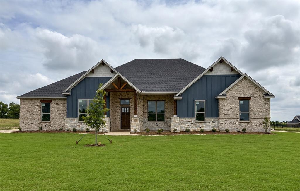 THIS HOME IS THE TOTAL PACKAGE: ATTRACTIVE, LOW MAINTENANCE, FINANCIALLY RESPONSIBLE (HELLO, LOW TAXES & WARRANTIES) AND COMES WITH A 3 CAR GARAGE, BETTER SWIPE RIGHT BEFORE SOMEONE ELSE DOES! Situated on a private 1-ACRE lot, this brand-new home delivers the space, quality, and flexibility buyers are searching for—at a price that's HARD TO BEAT. The open floorplan offers 4 bedrooms plus an office. Every room is generously sized with WALK-IN CLOSETS, giving everyone plenty of room to spread out. At the center of the home is an ENORMOUS kitchen built for entertaining, featuring a massive island, custom soft-close knotty alder cabinetry, and storage for days. The spacious living room showcases a floor-to-ceiling stacked stone wood-burning fireplace with a custom cedar mantle, creating the perfect gathering space. Additional upgrades include wood-look tile throughout the main living areas, entry, and office, upgraded matte black fixtures, ceiling fans in every room, quartz countertops in all bathrooms, and custom cabinetry throughout. Bring the TEXAS SIZED TRUCK! The OVERSIZED 24x30 THREE-CAR GARAGE features 8-foot doors designed to accommodate larger vehicles with ease, plus Hardie board baseboards for added durability. Enjoy peaceful country living from the covered front and back porches while benefiting from NO CITY TAXES and a LOW 1.5% tax rate. Located in highly sought-after MAYPEARL ISD and less than 10 minutes from shopping, dining, and everyday conveniences, with quick access to both I-35E and I-35W for an easy commute anywhere in the Metroplex. Estimated completion is October, giving buyers the rare opportunity to secure the home now and select many of their own colors and finishes. Photos are of the builder's completed homes in the neighborhood and are intended to represent quality, craftsmanship, and design. EVERYTHING IS BIGGER IN TEXAS... AND THIS HOME PROVES IT. ROOMS ARE SO MUCH BIGGER IN PERSON! The only thing that's not oversized is the price tag.