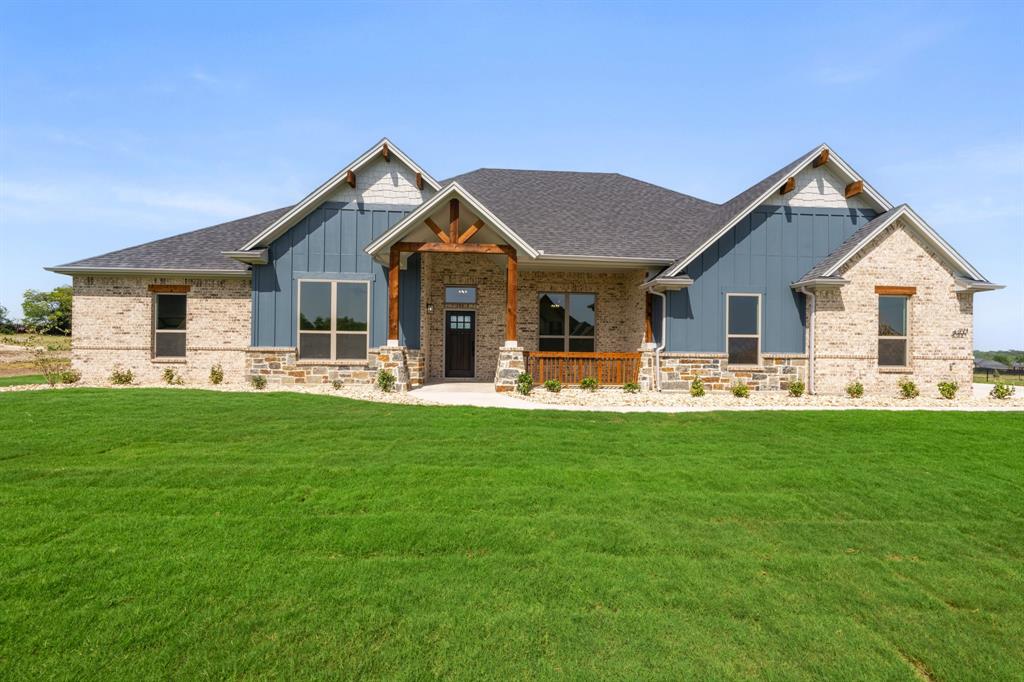 THIS HOME IS THE TOTAL PACKAGE: ATTRACTIVE, LOW MAINTENANCE, FINANCIALLY RESPONSIBLE (HELLO, LOW TAXES & WARRANTIES) AND COMES WITH A 3 CAR GARAGE, BETTER SWIPE RIGHT BEFORE SOMEONE ELSE DOES! Situated on a private 1-ACRE lot, this brand-new home delivers the space, quality, and flexibility buyers are searching for—at a price that's HARD TO BEAT. The open floorplan offers 4 bedrooms plus an office. Every room is generously sized with WALK-IN CLOSETS, giving everyone plenty of room to spread out. At the center of the home is an ENORMOUS kitchen built for entertaining, featuring a massive island, custom soft-close knotty alder cabinetry, and storage for days. The spacious living room showcases a floor-to-ceiling stacked stone wood-burning fireplace with a custom cedar mantle, creating the perfect gathering space. Additional upgrades include wood-look tile throughout the main living areas, entry, and office, upgraded matte black fixtures, ceiling fans in every room, quartz countertops in all bathrooms, and custom cabinetry throughout. Bring the TEXAS SIZED TRUCK! The OVERSIZED 24x30 THREE-CAR GARAGE features 8-foot doors designed to accommodate larger vehicles with ease, plus Hardie board baseboards for added durability. Enjoy peaceful country living from the covered front and back porches while benefiting from NO CITY TAXES and a LOW 1.5% tax rate. Located in highly sought-after MAYPEARL ISD and less than 10 minutes from shopping, dining, and everyday conveniences, with quick access to both I-35E and I-35W for an easy commute anywhere in the Metroplex. Estimated completion is October, giving buyers the rare opportunity to secure the home now and select many of their own colors and finishes. Photos are of the builder's completed homes in the neighborhood and are intended to represent quality, craftsmanship, and design. EVERYTHING IS BIGGER IN TEXAS... AND THIS HOME PROVES IT. ROOMS ARE SO MUCH BIGGER IN PERSON! The only thing that's not oversized is the price tag.