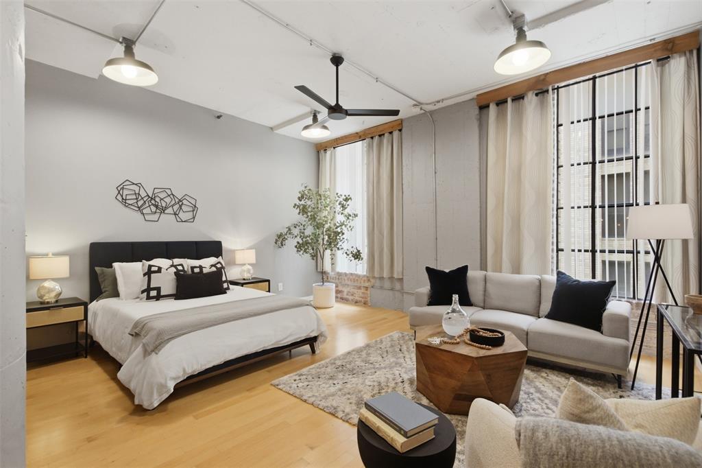 Welcome to Lock & Leave LOFT LIVING in exciting Downtown Dallas! Located in the Historical Santa Fe Terminal & WFAA Building. This spacious Industrial Loft is a blank slate waiting for you to make it your own! UPGRADES include: Thermostat, Custom Light Wood Closet System, restored Authentic Texas Warehouse Lights, MCM Sputnik Chandelier, Designer Paint on walls & columns in Neutral Gray & White Baseboards and 2022 Samsung Washer & Dryer Set; Kitchen has Stainless Steel Appliances & Refrigerator that will remain;HOA FEES INCLUDE: 24 Hour Front Desk Security, Onsite Gym, Laundry Room, Private Storage Unit & Bike Room near your front door, Rooftop Pool & Grills; Private Outdoor Patio Space, Assigned Secured Parking Spot #135 in Underground Garage PLUS Utilities: Water, Sewer, Garbage & Internet Service. High WALKABILITY SCORE of 91. Walk to: Dallas Farmers Market, AT&T Discovery District, DART rail stations, Restaurants, bars, and cafés in Downtown-West End, Klyde Warren Park and the Arts District. LOCATION DELUXE!