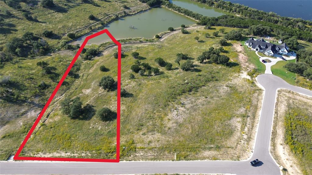 Welcome to Luker Ranch! Luker Ranch is located on the outside of Granbury and right off Lake Granbury, close to all the amenities your heart desires and the seclusion of being nestled in the country. Luker Ranch is only a short drive from Glen Rose Hwy and only 10 miles from shopping, dining, and everything Granbury has to offer. 8040 Brownie Luker Boulevard is a beautiful 3.011-acre residential lot located in the beautiful Luker Ranch subdivision. The lot is wide open, with a sloped landscape going down to a private community pond, offering the perfect setting for creating your dream home, with plenty of room for outdoor living, recreation, and breathtaking views of Lake Granbury. Enjoy the tranquility and charm of this sought-after area, where you can build a custom home tailored to your vision while being part of a friendly and welcoming community. Give us a call to find out more about 8040 Brownie Luker Boulevard and other lots available at the beautiful Luker Ranch!