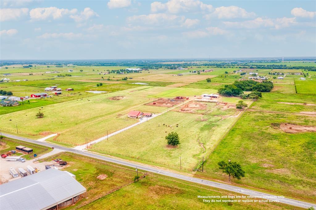 Available for the first time in over 20 years this 25 acre working ranch is a must see. Currently configured for a rodeo bull operation, this Swiss army knife of facilities can quickly be converted to suit almost any cattle or horse needs. The 265 x 140 arena is currently set up for roping. The property has three 40 x 30 barns that can be used in a variety of ways. With the proper approach and vision they could even be retrofitted to horse stalls if needed. The fourth barn a 47 x 35 has three stalls, wash rack, tack room and storage. The property is cross fenced. Allowing multiple turn out options. The home is 2100 square feet, three bedroom two bath with an open floor plan.