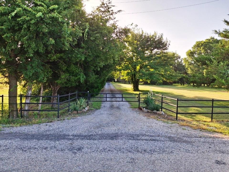 Beautiful 4.81 acres with a 1588 sq. ft. custom built home in the highly rated Van Alstyne school district only a 20 minute drive to McKinney. 
This is an outstanding opportunity!! The growth in the area makes the an excellent time to look at this property. Whether you're looking for an investment property or just looking for a beautiful well built home with a large outside patio area to relax and unwind from the day. The additional 1380 sq. ft. shop with 570 sq. ft. of living area is an ideal spot for a home office or game room. Property has an abundance of large trees for shade during the hot summer months ahead. 
So, if you're for the potential investment property that can provide rental income before development or you're just looking for place with some space to call home. 
The potential on for this property is limitless.