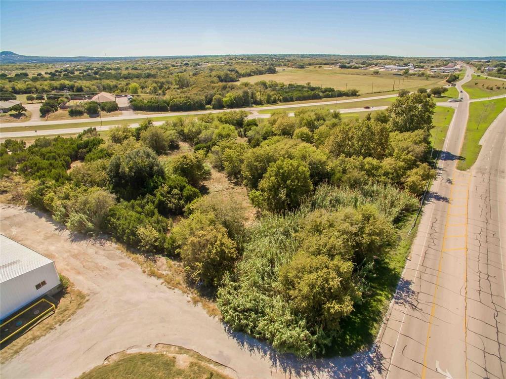 GREAT OPPORTUNITY! Three tracts of commercial property forming the 4.2 acre triangle of land where Hwy 377 meets Pearl Street at the west end of Granbury.  Perfect location for gas station, convenience store or any business with easy Hwy 377 access. Much more affordable than central Granbury area.  5 foot drainage pipe installed.  Motivated seller.  BRING ALL OFFERS! Buy, Trade, etc.