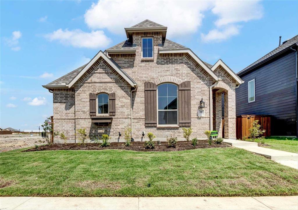 MLS# 20426654 - Built by Highland Homes - Ready Now! ~ Gorgeous Elevation...home includes mahogany craftsman style entry door, upgraded kitchen with 5 burner gas cooktop, stacked ovens, vent to exterior, white painted cabinets, granite counters, single bowl sink and pendant lights over island, primary suite with drop-in tub, fireplace in family room, upgraded luxury vinyl plank in main areas!