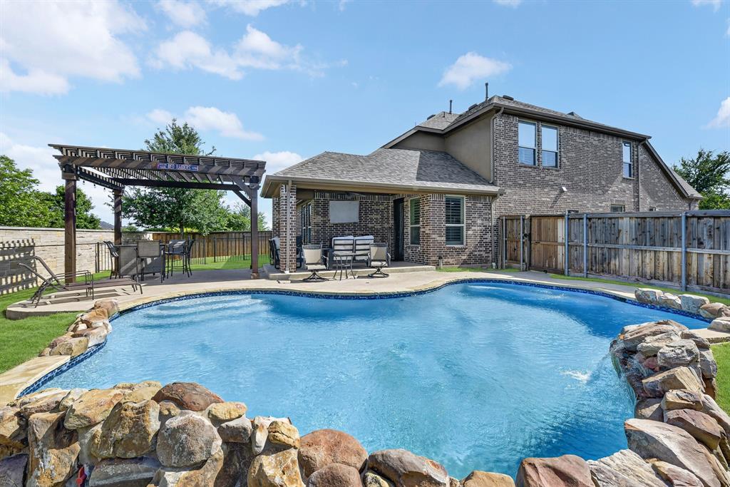 ***SPRING INTO SAVINDS!***Your Private Pool is waiting for you!! As Summer is fastly approaching, don't miss the chance to make this your new home! Plan the POOL PARTY already!!! Just in time for summer—your private backyard oasis awaits! This beautifully custom-built home offers the perfect blend of luxury, comfort, and functionality. Step outside to a stunning outdoor living space featuring a sparkling custom pool, a shaded pergola, and a covered patio—ideal for relaxing, entertaining, and cooling off all season long.

Inside, you’ll find a thoughtfully designed, light-filled open floor plan with elegant finishes, soaring ceilings, and seamless flow between living, dining, and kitchen spaces. The gourmet kitchen opens effortlessly to the main living area, creating a warm and inviting atmosphere for gatherings of any size.

The private owner’s suite provides a peaceful retreat, complete with a spa-like ensuite bath. Downstairs also includes a dedicated office—perfect for working from home. Upstairs, a spacious bonus room offers endless possibilities for a game room, media space, or additional living area.

The backyard is fully equipped with a separate dog run, making it easy to accommodate your furry friends while maintaining a pristine outdoor space.

This exceptional home combines style, comfort, and outdoor living at its finest. Don’t miss your chance to make this your new home!