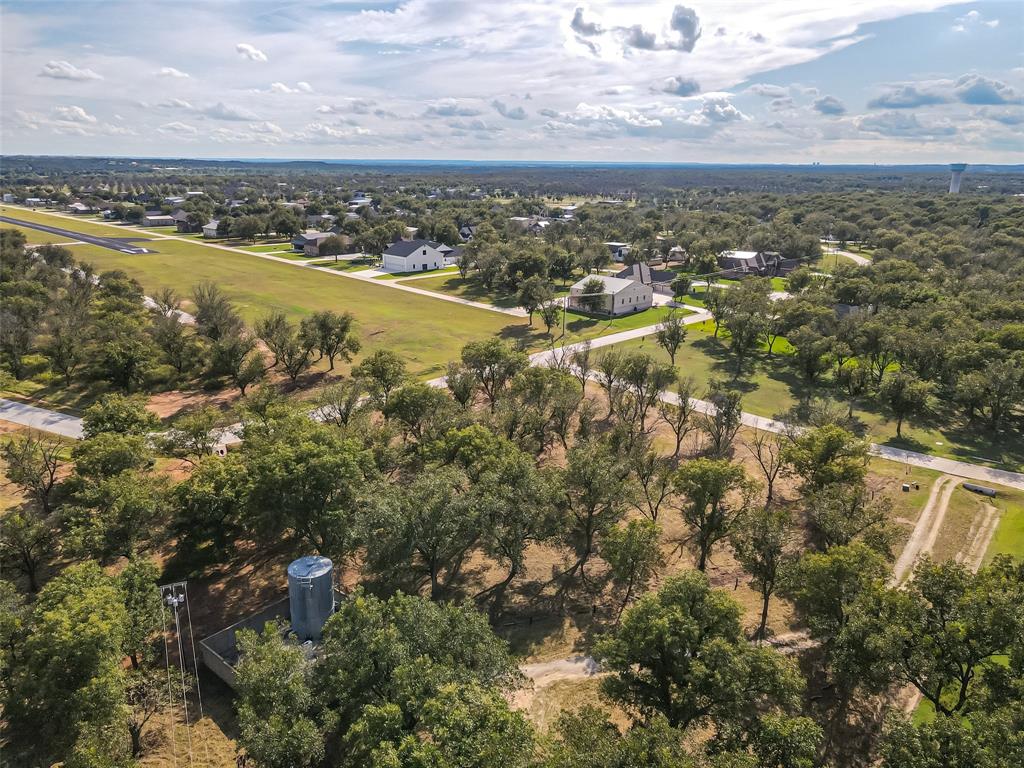 Beautiful 1.6 acre lot in Pecan Plantation, offering a spacious and private setting to build your dream home.  Conveniently located next to an additional 1.9 acre lot (listed separately), this property gives buyers the rare opportunity to purchase both and combine them into a 3.5 acre estate sized homesite.  Enjoy the lifestyle and amenities Pecan Plantation has to offer, including golf, clubhouse, parks, air park, and more.  This lot is the perfect canvas to design the home and lifestyle you've been dreaming about.  Drone photos coming soon!
