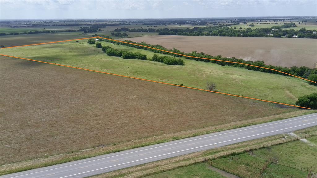 29.29 Acres with Highway 51 Frontage fenced and ready!  Bring your cows and horses, build your Dream Home, or subdivide a new neighborhood, opportunity is here and the options are endless!  Boundary on the south side is the creek, lots of grazing acreage, several mature trees, multiple build site possibilities, Metal Awning ready to store hay and equipment on site.  Come take a look at this amazing property Today!