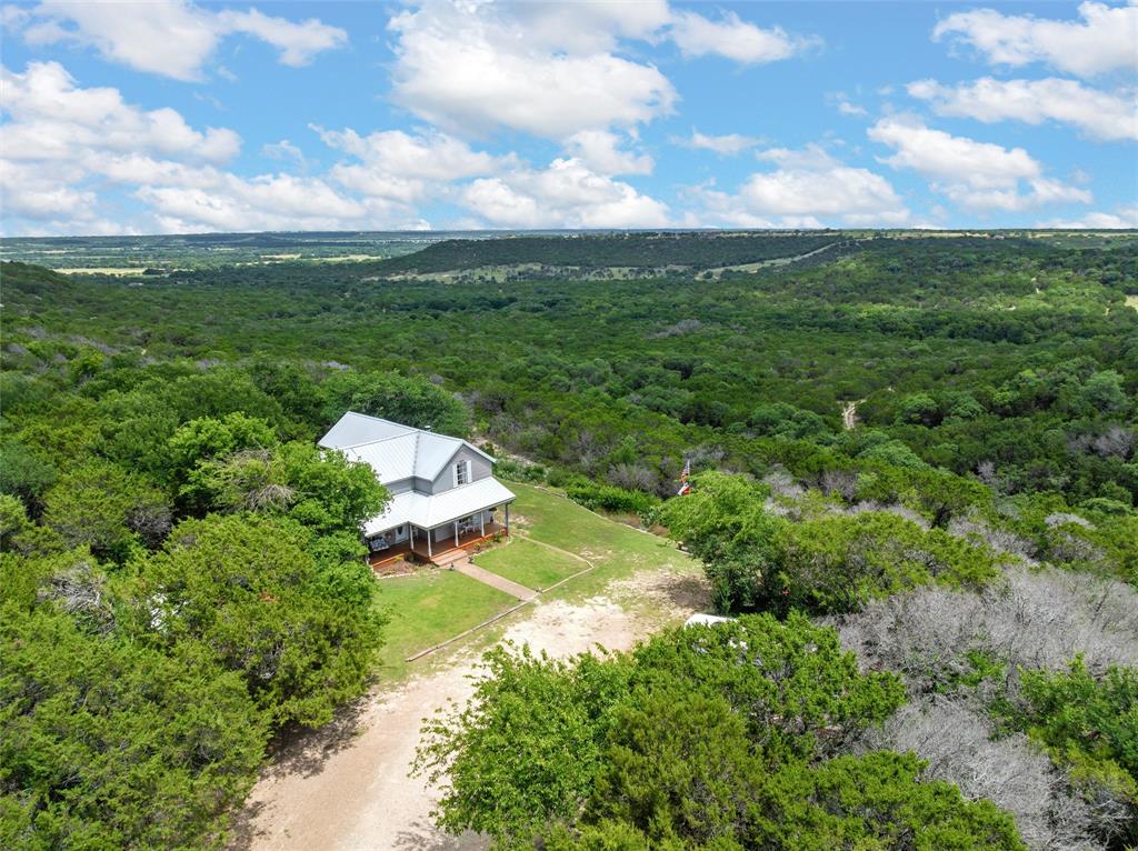 Discover the charm of this historical two-story home nestled on 4 acres of serene land, offering breathtaking views of the picturesque valley. About two of these acres are unobstructed and sloped! Enjoy the ultimate seclusion while being surrounded by nature, and a good possibility of seeing wildlife from the large porch! 

This spacious home features 4 bedrooms and 2 baths, with large rooms perfect for family gatherings or entertaining guests. Two living spaces provide flexible living arrangements, whether for cozy family time or hosting friends. The large kitchen allows you to experience stunning views from the window while preparing meals, making every cooking session a delight. 

Equipped with central heat and air, you’ll enjoy comfort year-round, no matter the season. Relax in the clawfoot tub, adding a touch of vintage charm to your daily routine. The quiet and relaxing atmosphere makes this property an ideal retreat from the hustle and bustle of everyday life.

The back porch is the perfect spot to unwind with a book, watch the kids play, or simply enjoy the tranquility of your surroundings. This property would also make an excellent investment for an Airbnb, attracting visitors looking for a peaceful getaway.

Don’t miss the chance to own a piece of history with the best views in Bosque County! Originally located in town, this charming home was moved to its current breathtaking location in the 80s, ensuring that every morning starts with a coffee in hand and a view to inspire. Schedule a visit today and fall in love with your new home!