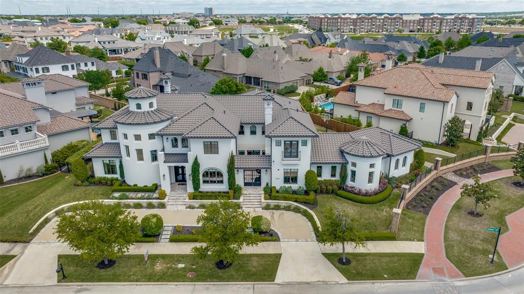 Exquisite custom Transitional Mediterranean Ron Davis home prominently located in highly desirable Newman Village. Soaring 20-foot ceilings and impeccable finishes. Residence emanates sophistication and refinement. Interior boasts a captivating rotunda entry, 5 BR, 5.2 Bath, 2 living areas, study, library, and gourmet kitchen replete with commercial-grade appliances, gas cooktop, coffee station. Opulent master suite features circular shower and expansive custom wardrobe. Guest BR on the first floor and 3 BR, game room, and media room upstairs, all with en-suite bathrooms. Outdoor oasis equally remarkable, showcasing pool, fireplace, fire pit, oversized outdoor kitchen. Residence outfitted with energy star appliances, Radio RA2 Lutron lighting controls, an Elon media system, mudroom, office nook, oversized utility and craft room. Expansive 3-car garage and electric gate contribute to convenience and security. Property offers the perfect blend of luxury, style, and functionality.