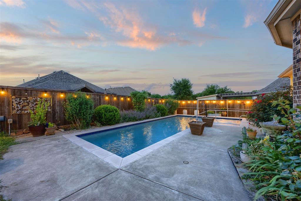 Welcome to the lifestyle you've been waiting for. Tucked away in the highly desirable Auburn Hills community and served by Prosper ISD, this beautifully designed single-story home offers the perfect blend of everyday comfort and resort-style living.  Imagine starting your mornings with coffee on the covered patio, spending warm Texas afternoons floating in your heated gunite pool, and ending the day gathered with family and friends under the stars. This private backyard was designed for making memories—not maintaining them.  Inside, the open-concept floor plan creates a warm and inviting atmosphere where everyone stays connected. The spacious kitchen flows effortlessly into the living and dining areas, making everything from weeknight dinners to holiday celebrations feel effortless. A versatile flex room offers endless possibilities as a home office, media room, playroom, or guest retreat—adapting to your lifestyle as your needs evolve.  The peaceful primary suite provides a relaxing escape, while the thoughtfully designed layout offers privacy and functionality for family and guests alike.  Located in one of McKinney's most sought-after communities, you'll enjoy scenic walking trails, neighborhood parks, resort-style amenities, and convenient access to shopping, dining, and major commuter routes. With no MUD or PID taxes, you'll enjoy exceptional value along with an exceptional lifestyle.  Why wait months to build a backyard oasis when this one is ready to enjoy today? This is more than a home—it's the place where your next chapter begins.