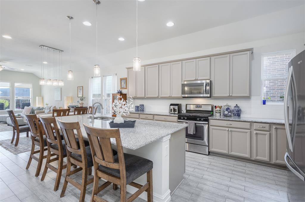 Welcome to your private retreat in Auburn Hills. This beautifully designed single-story home offers three bedrooms, two baths, a large flex room, and an effortless open-concept layout that lives both comfortably and elegantly. Step outside and discover the true showstopper- your own backyard oasis. The sparkling heated pool with sundeck for three creates a perfect setting for summer gatherings, weekend relaxation, or a quiet evenings under the Texas sky.  Get instant equity with a custom gunite heated pool with sundeck saves you a year of construction and is already here to jump in. Inside you’ll find natural light fills the spacious living area, seamlessly connecting to the kitchen and dining space - ideal for entertaining or simply enjoying everyday moments at home. The thoughtfully designed floor plan provides a private primary suite tucked away from the secondary bedrooms, creating a peaceful escape at the end of the day with views of the pool oasis. Be sure to check out this his AND hers closets. The versatile, large flex space offer flexibility for guest, a home office, a second living space for the sports enthusiast or a play space. Located in one of McKinney‘s most desirable communities, Auburn Hills offers beautiful walking trails, parks, and resort style amenities. At the center of the Golden Corridor - McKinney airport expansion with commercial flight soon, Universal Kids Resort, Sunset Amphitheater - a world-class music venue coming 2027,  within seconds from the new Whole Foods, H-E-B, Costco and multiple dining and entertainment right on 380. This home is complete and move-in which offers everything you love about McKinney living. No MUD or PID taxes, finished luxuries including mature landscaping, custom window treatments, a pool ready summer and the desired Auburn Hills community.