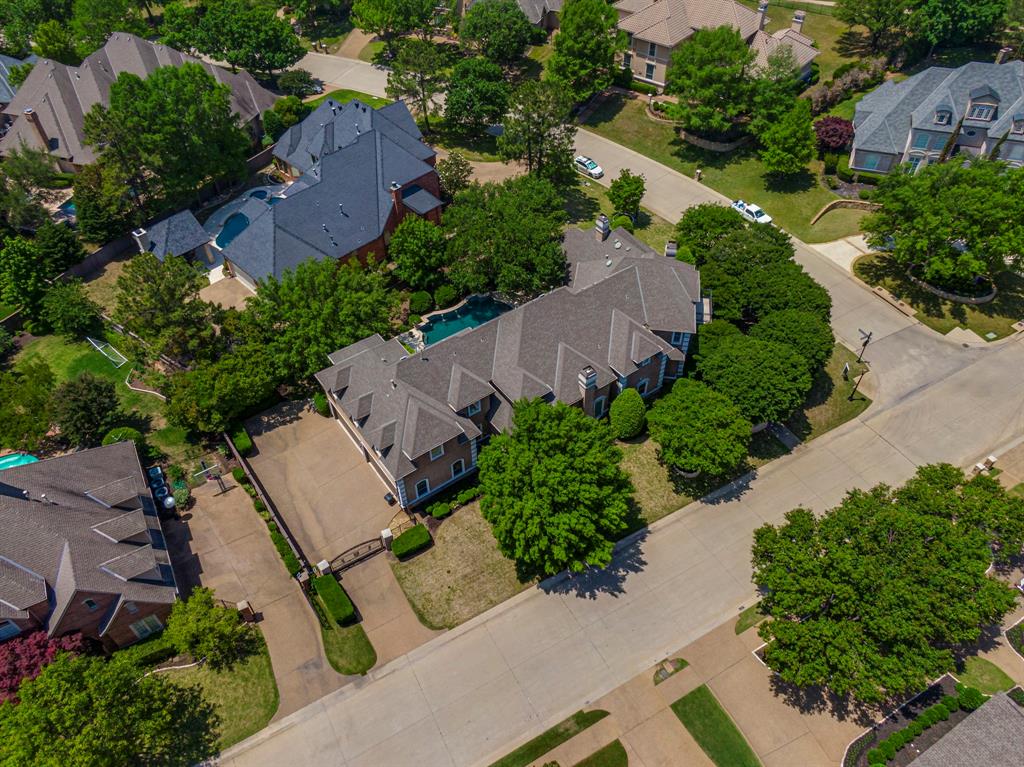 Welcome to your beautiful dream home in the desirable Timarron community of Southlake! Step inside & you'll be greeted by a spacious & elegant interior, complete with high ceilings, gleaming hardwood floors, & exquisite finishes throughout. The living room features a cozy fireplace, while the gourmet kitchen is a chef's paradise, with top-of-the-line appliances & a large island with plenty of space for entertaining. One of the true highlights of this home is the spectacular outdoor space - step outside onto the expansive patio & take a dip in your sparkling pool, or relax in the shade of the covered seating area or balcony. This property also features a Tesla charging station in the garage, providing convenient charging for your electric vehicle. Located in one of Southlake's most coveted neighborhoods, the community features a championship golf course, a resort-style pool, a fitness center, tennis and sports courts, parks with scenic trails, playgrounds, and community events. The area offers a wealth of activities for every interest - enjoy upscale shopping and dining at Southlake Town Square, explore outdoor adventures at Bicentennial Park, Bob Jones Nature Center, and nearby Lake Grapevine, or stay active at Lifetime Fitness and The Marq.