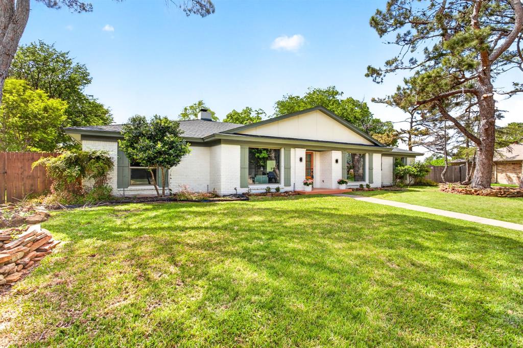 This beautifully renovated 1-story home in Ridglea Country Club Estates blends classic, ranch-style architecture with fresh, thoughtful design! Featuring 4 bedrooms, 3 full baths, and a large 2-car side entry garage on nearly half an acre-treed lot, this home showcases a seamless open-concept layout centered around a stunning kitchen and living room with brick focal fireplace and built-ins with floating shelves. Expansive sliding glass doors open to the oversized backyard and pool, creating an effortless indoor-outdoor flow ideal for entertaining. Large picture windows fill the front living (could be an optional play room or home office), formal dining, and breakfast room with natural light. The eat-in kitchen is a dream with quartz countertops, modern Shaker design cabinetry, breakfast bar seating, microwave drawer, stainless appliances with vent hood and a pantry. The primary suite is private with a spa-like bathroom and 2 closets! A separate guest bedroom and full bathroom is split from the rest of the bedrooms which makes for a nice guest retreat or home gym. The extensive renovation includes all new windows, stainless appliances, landscaping, flooring, paint, lighting, plumbing fixtures and gorgeous tile all selected to elevate the home’s timeless character. Located just minutes from the golf courses and amenities of Ridglea Country Club, easy access to 183, I-20 and I-30, plus nearby shopping and dining at Clearfork. This home combines refined living with an exceptional West Fort Worth location!