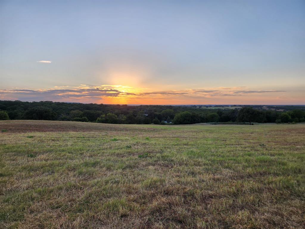 Sweeping views and heavenly sunsets. Multiple breathtaking sites await your future dream home. Truly a one of a kind property situated in the heart of the North Texas hill country. This stunning property is located one mile from the Blue Ostrich and the 4R Winery and ten minutes to the charming town of St Jo. Recently updated Barndominium with new paint, ceiling fans, bathroom fixtures and custom lighting. Nations water purification system throughout the home. Custom 8 stall barn with feed room and designer tack room. Two cross ties-wash racks. One 50 foot round pen and a Corral with a three stall loafing shed for horses or livestock. A 30x40 hay barn adds even more functionality to this exceptional property. Three large pastures with cross fencing and gated entrance. Two ponds with one fully stocked. Not a horse person? The barn stalls can easily be removed to create an extraordinary event space, upscale main residence, guest retreat, or showroom-worthy collector car garage. And the fencing can be removed or reconfigured to suit any vision. Ag exempt property with producing hay field. Horse-jogging trails throughout the wooded area of the property. Where horses, wide open skies and rolling hills become your everyday. Only 10 min to Muenster and 30 min to Gainesville. A once in a lifetime opportunity to own something truly special.