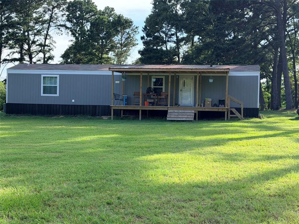 PLEASE NOTE: This property can be purchased separately, or all together. Refer to the survey. 
Discover the possibilities with this unique property featuring TWO SEPARATE dwellings, multiple outbuildings, and plenty of room for livestock, hobbies,  multi-generational living, or country living with income potential on a total of 9.894 acres. HOME#1 2025, 820 sf single-wide mobile home,(5.9 acres) 2 bed. 2 bath. with front and back porches, perfect for morning coffee or evening cocktail. This home is move in ready with all new smart features. Home#2 (MLS#21302249-3.985 acres) is a Ranch style 3 bed. 2 bath FIXER-UPPER with vaulted ceilings, built with a metal frame, metal siding and metal roof in 2013. There is also a shop, 2 outbuildings and a small pond. Enjoy the peace and privacy of country living while remaining conveniently located near Canton and its amenities. Whether you're looking for a family compound, investment property, or a place to build your dream rural lifestyle, this property offers endless possibilities. There are also 2 tractors and multiple implements that are negotiable with this sale.